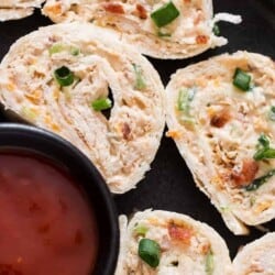 Chicken enchilada tortilla roll-ups are perfect appetizers for game day, parties or any gatherings that you can put together easily