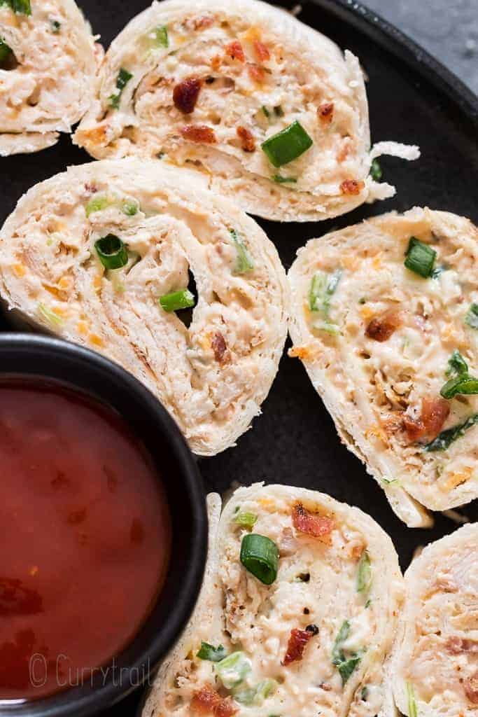 Chicken enchilada tortilla roll-ups are perfect appetizers for game day, parties or any gatherings that you can put together easily