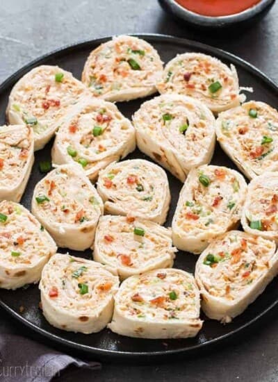 Chicken enchilada tortilla roll-ups are perfect appetizers for game day, parties or any gatherings that you can put together easily