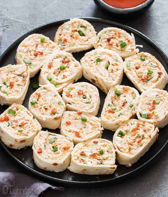 Chicken enchilada tortilla roll-ups are perfect appetizers for game day, parties or any gatherings that you can put together easily