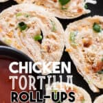 enchilada roll ups served with sauce on black plate with text