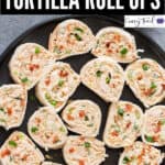 chicken enchilada tortilla roll ups on black plate with text