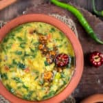 dal palak served in earthen pots is simple dal recipe with goodness of spinach with text overlay
