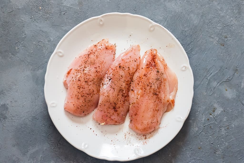 chicken breasts seasoned with salt, pepper and smoked paprika.
