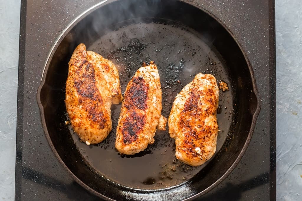 seared chicken breasts in cast iron pan to brown it.