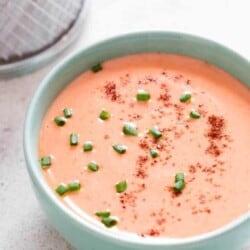 bang bang shrimp sauce in bowl with fried shrimps on side