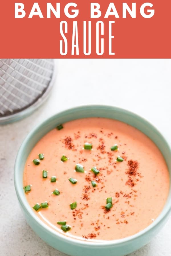 bang bang shrimp sauce in bowl with fried shrimps on side with text overlay