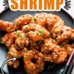 bang bang shrimp on black plate with chopsticks with text overlay
