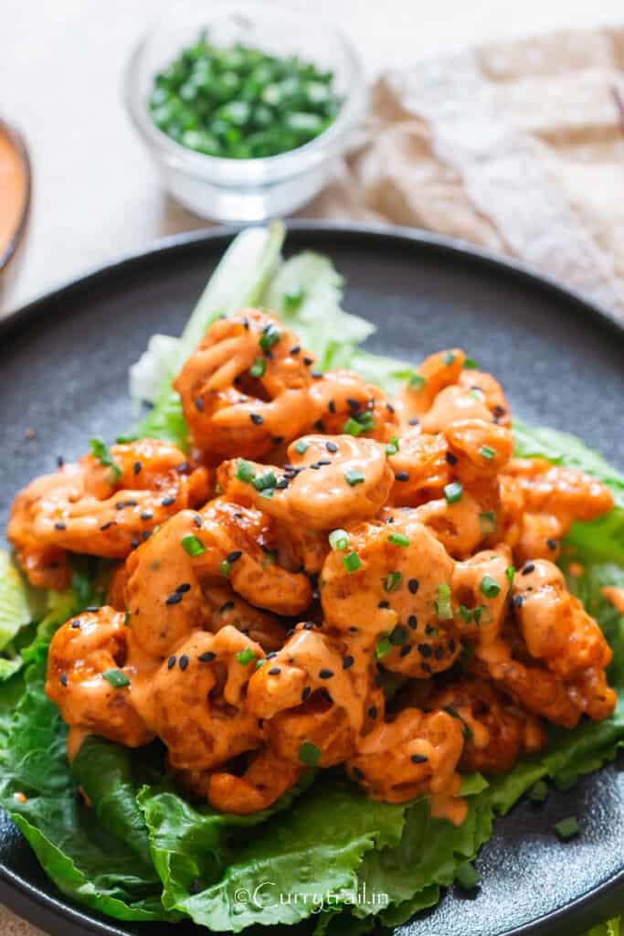 bang bang shrimp on lettuce leaf.