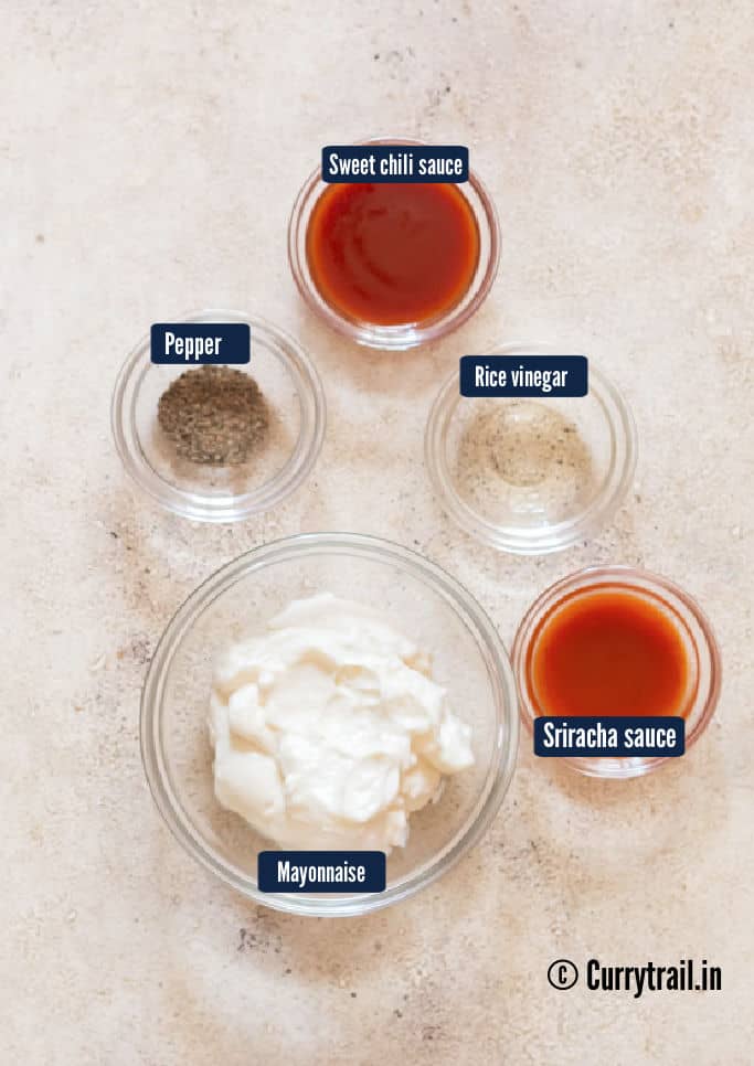 all ingredients for bang bang shrimp are arranged on a wooden table.