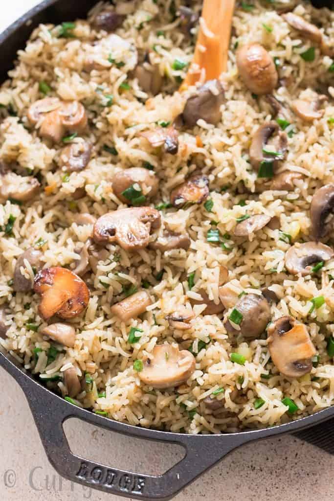 one pot mushroom rice cooked in cast iron skillet