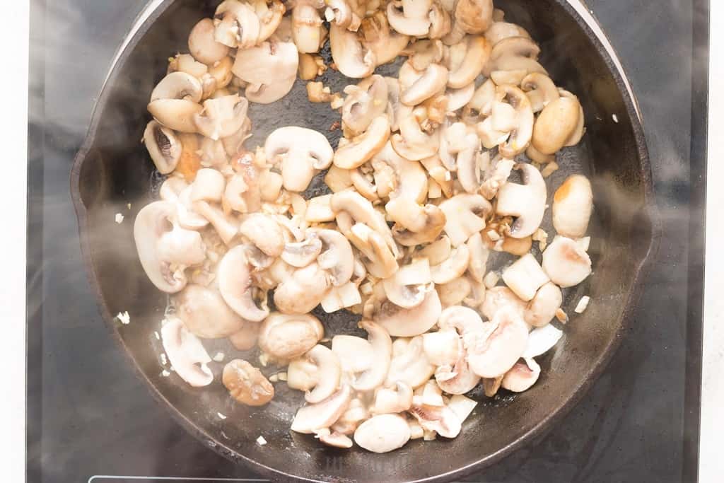 one pot mushroom rice cooked in cast iron skillet