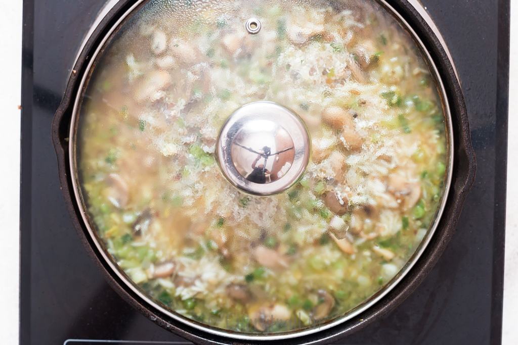 one pot mushroom rice cooked in cast iron skillet