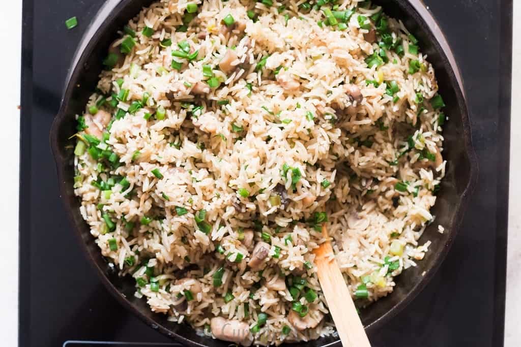 one pot mushroom rice cooked in cast iron skillet