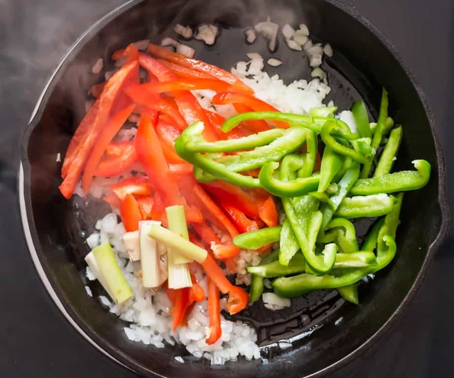 vegetables sautéed in a cast iron pan.