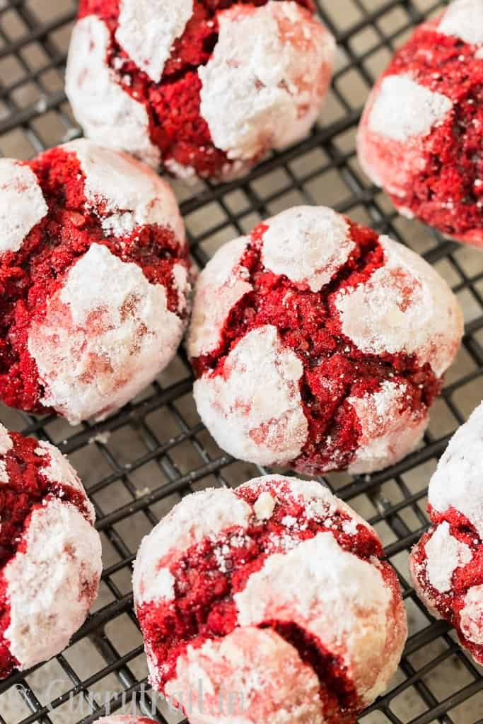 red velvet crinkle cookies lined on wired tray