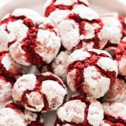 red velvet crinkle cookies lined on white plate