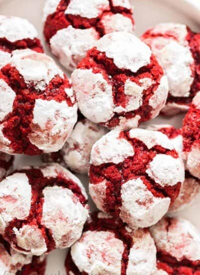 red velvet crinkle cookies lined on white plate