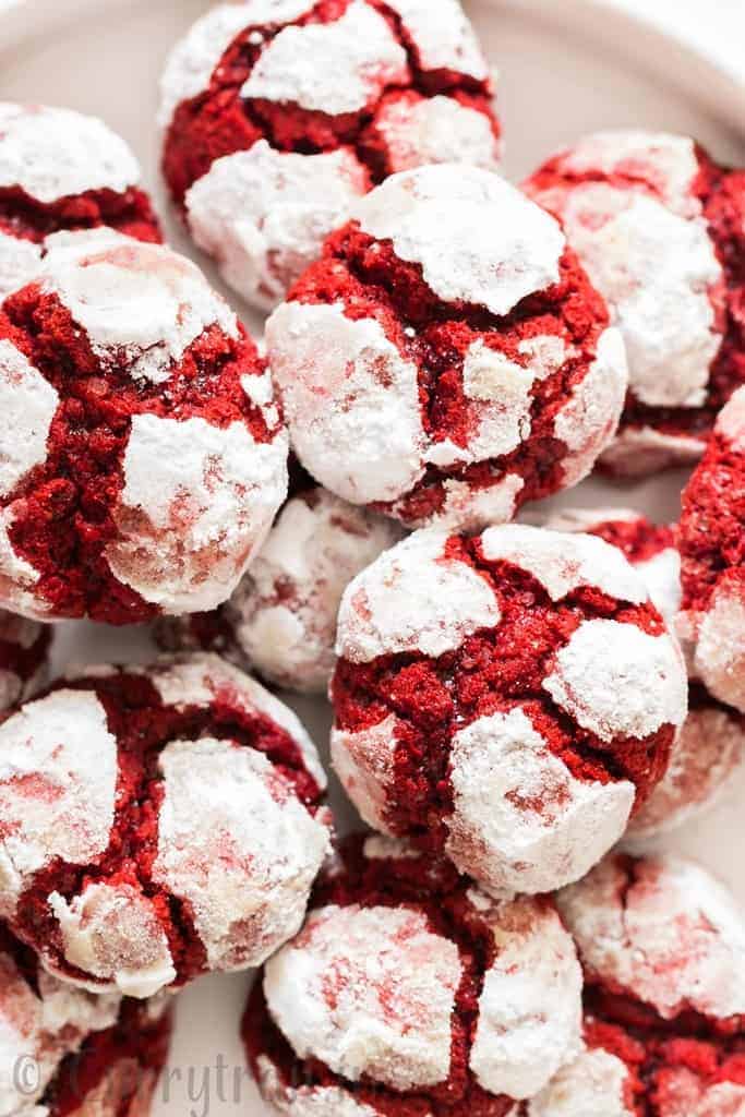 red velvet crinkle cookies lined on white plate