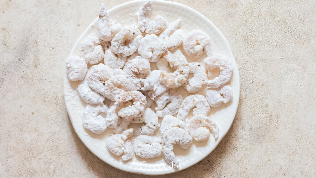 cornstarch-dredged shrimp on a plate.