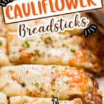 cheesy cauliflower breadsticks on baking tray with text