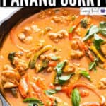 chicken panang curry in cast iron pan with text