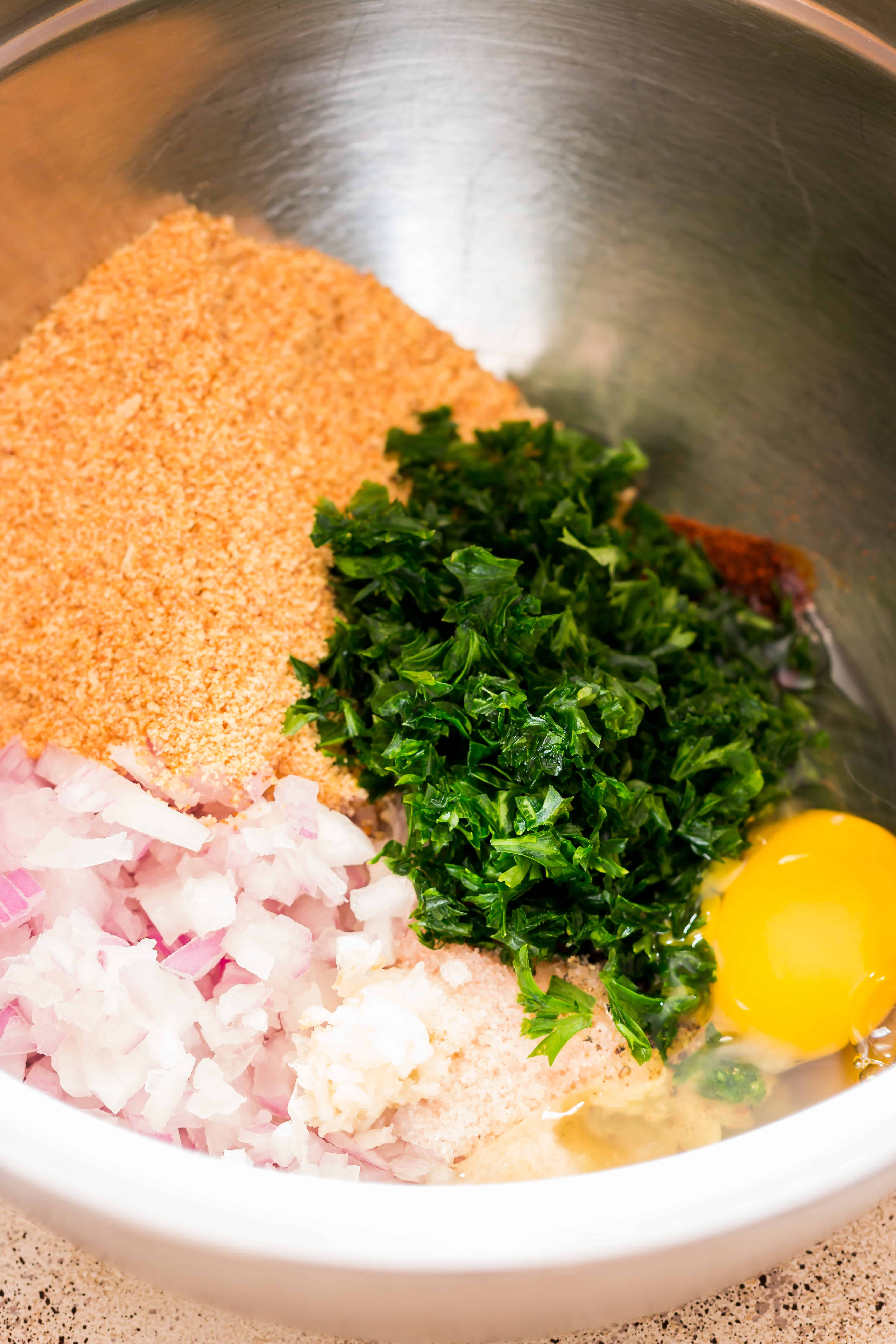 ingredients for chicken meatballs recipe in a bowl