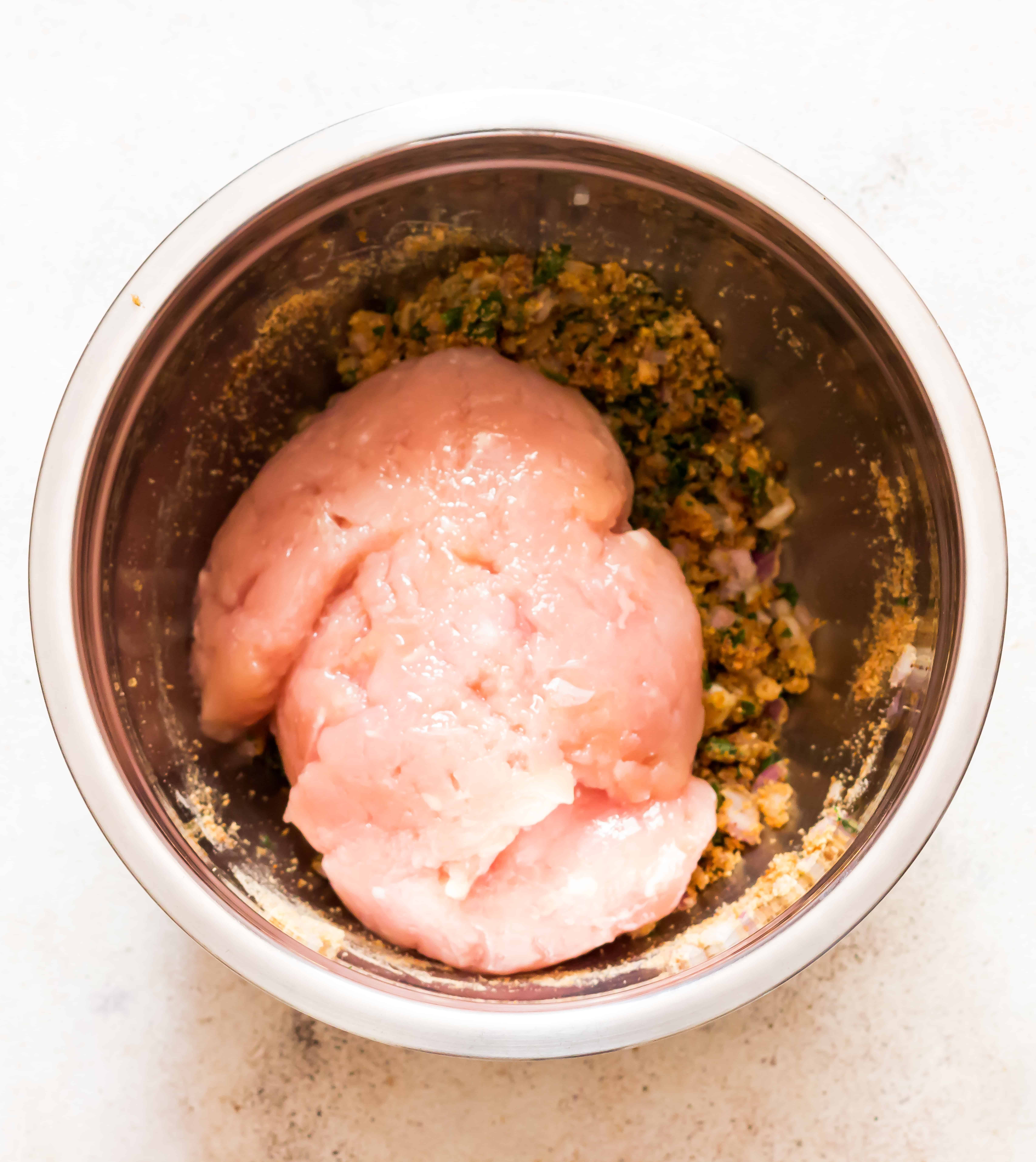 ingredients for chicken meatballs recipe in a bowl