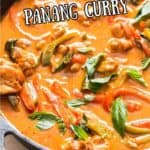 Thai chicken panang curry in cast iron skillet with text