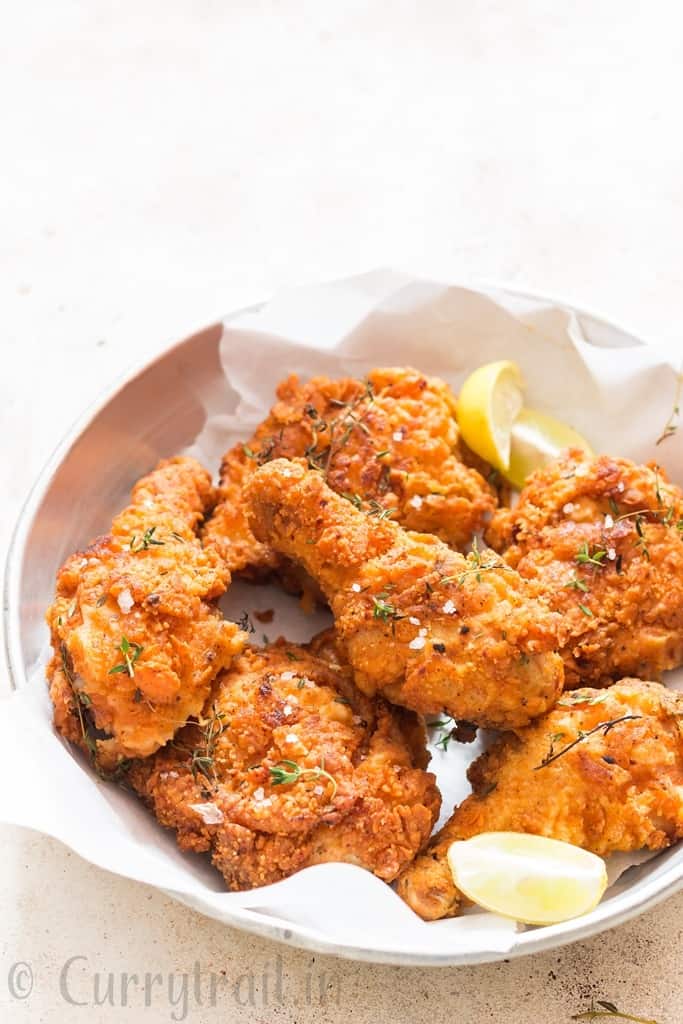 ultimate Southern fried chicken with lemon wedges
