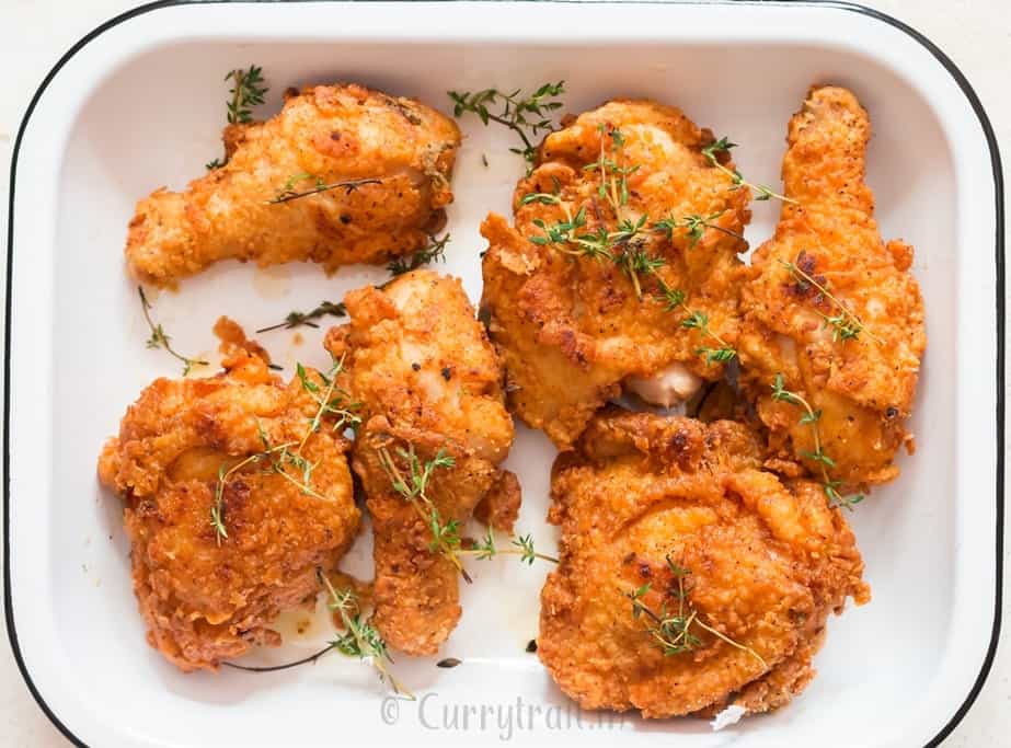 crispy fried chicken with fresh thyme.