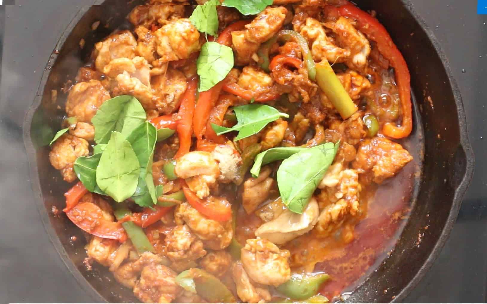 cook Thai curry with peanut butter, kaffir lime leaves, vegetables and chicken.