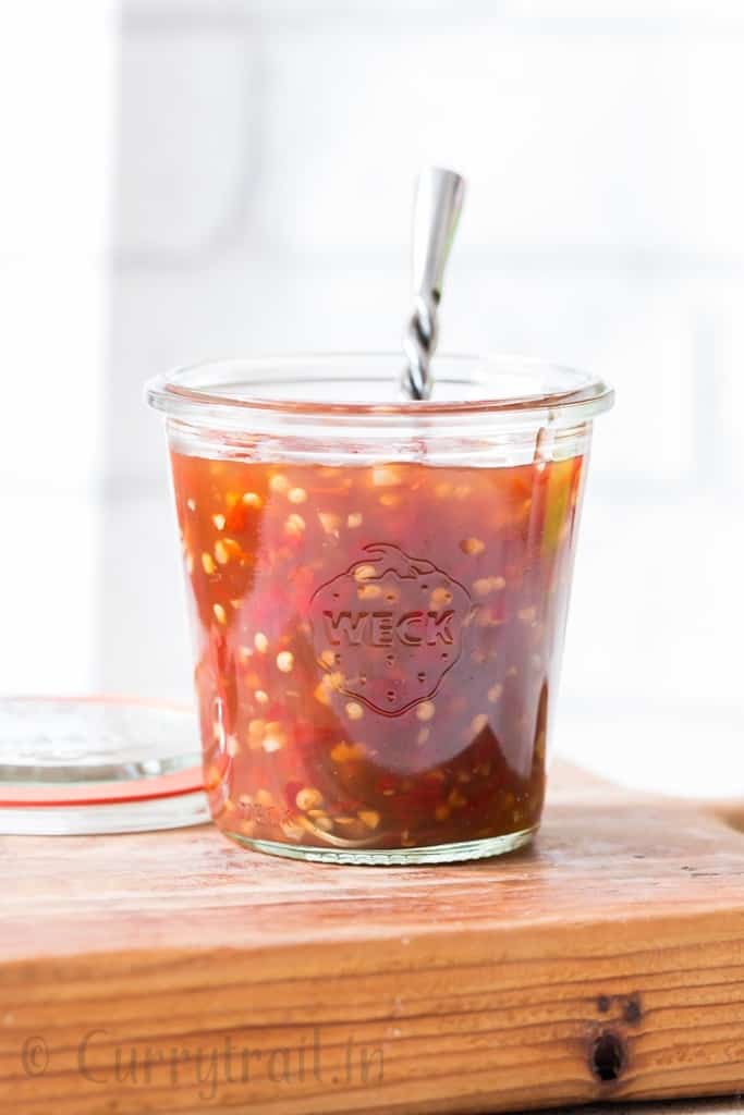 homemade spicy sweet chili sauce in glass jars