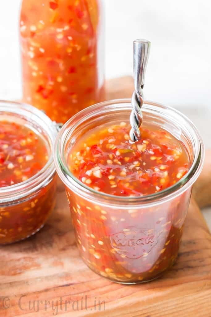 homemade spicy sweet chili sauce in 3 glass containers