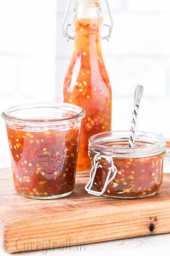 homemade spicy sweet chili sauce in 3 glass containers