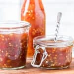 homemade spicy sweet chili sauce in 3 glass containers