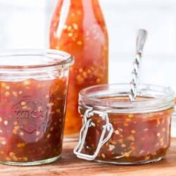 homemade spicy sweet chili sauce in 3 glass containers