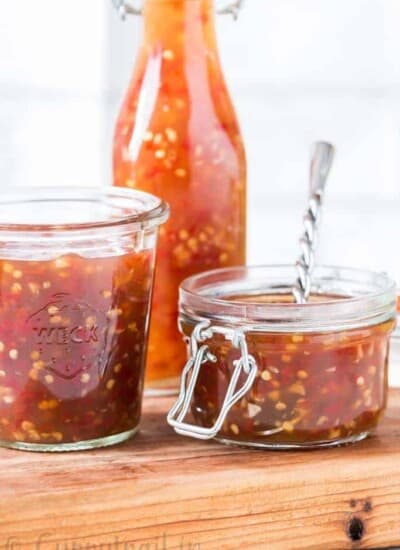 homemade spicy sweet chili sauce in 3 glass containers