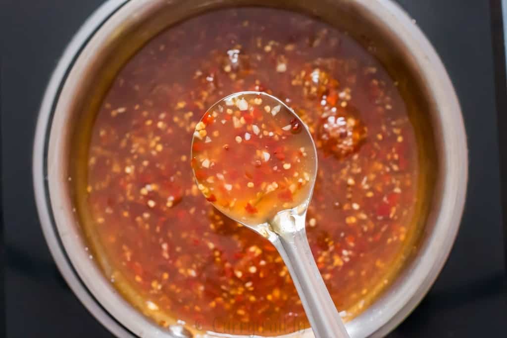 homemade spicy sweet chili sauce in pan