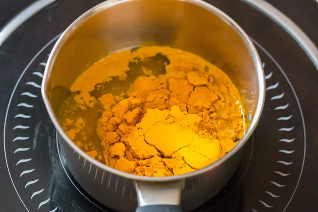 making turmeric paste recipe in sauce pan