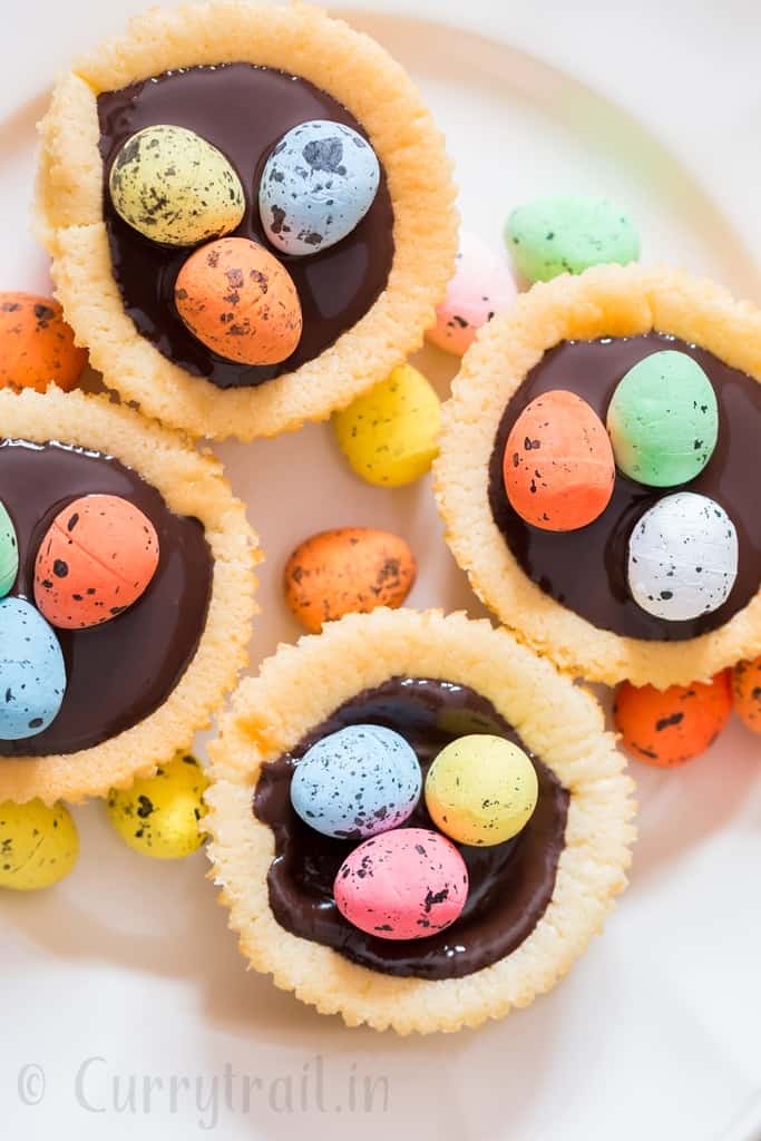 Easter mini cheesecake with dark chocolate and chocolate eggs on top