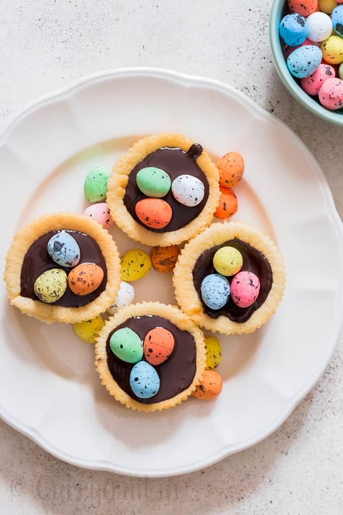 Easter mini cheesecake with dark chocolate and chocolate eggs on top