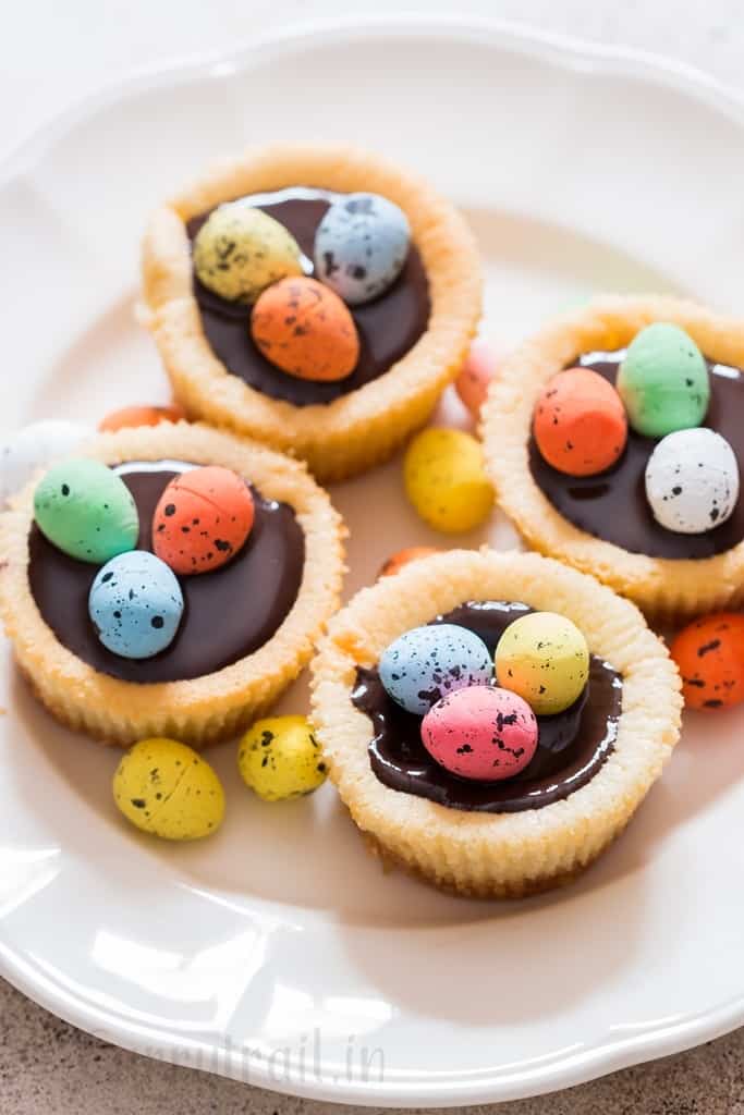 Easter mini cheesecake with dark chocolate and chocolate eggs on top