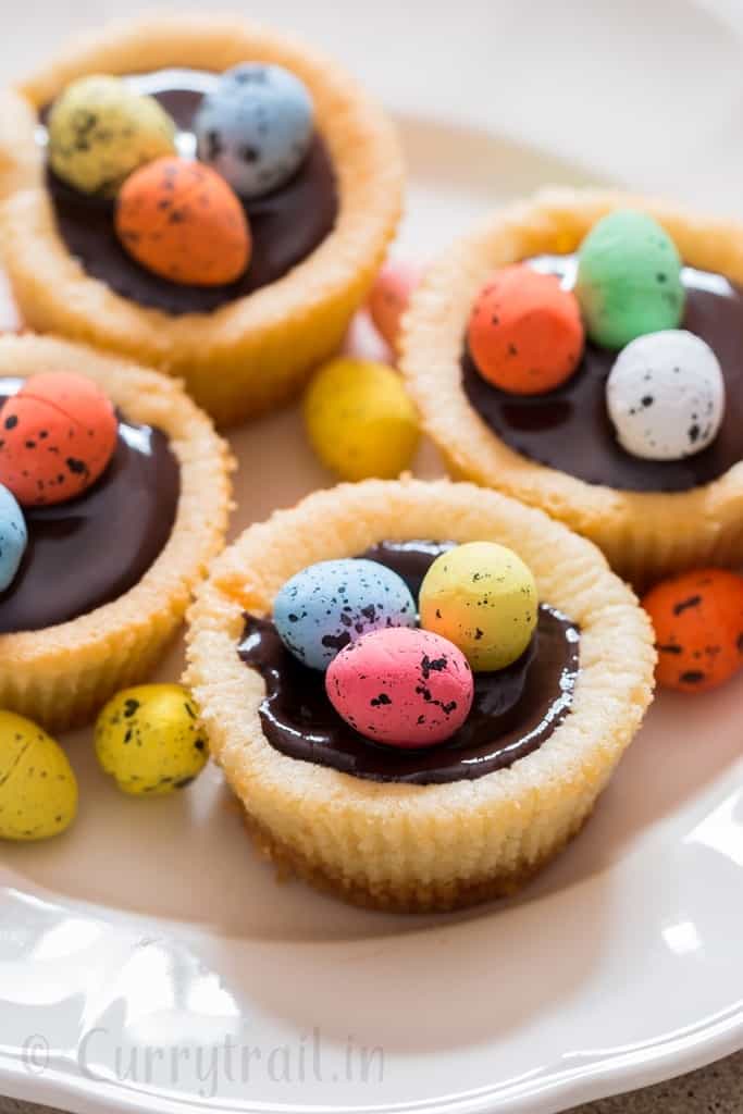 Easter mini cheesecake with dark chocolate and chocolate eggs on top