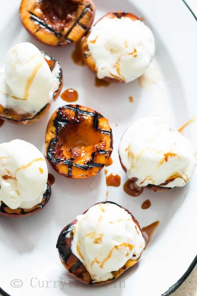 grilled peaches with vanilla ice cream and caramel sauce