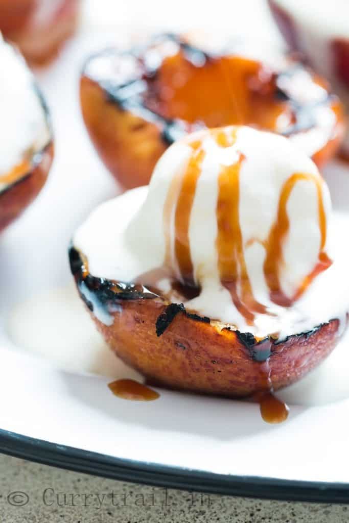 grilled peaches with vanilla ice cream and caramel sauce