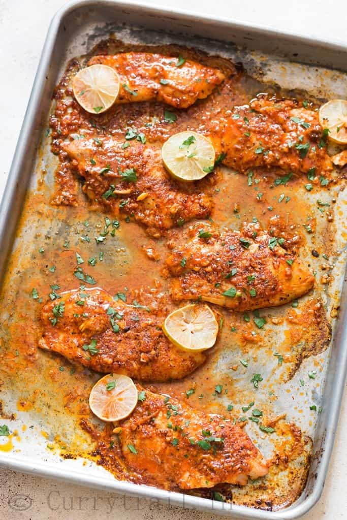 oven baked tilapia on baking sheet