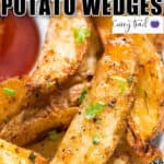 crispy baked potato wedges with tomato sauce with text overlay