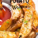 baked potato wedges served with ketchup on plate
