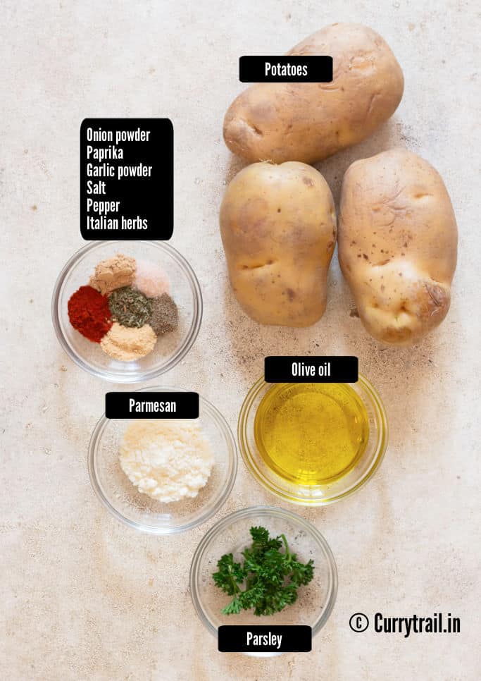 all ingredients for potato wedges on a white table.